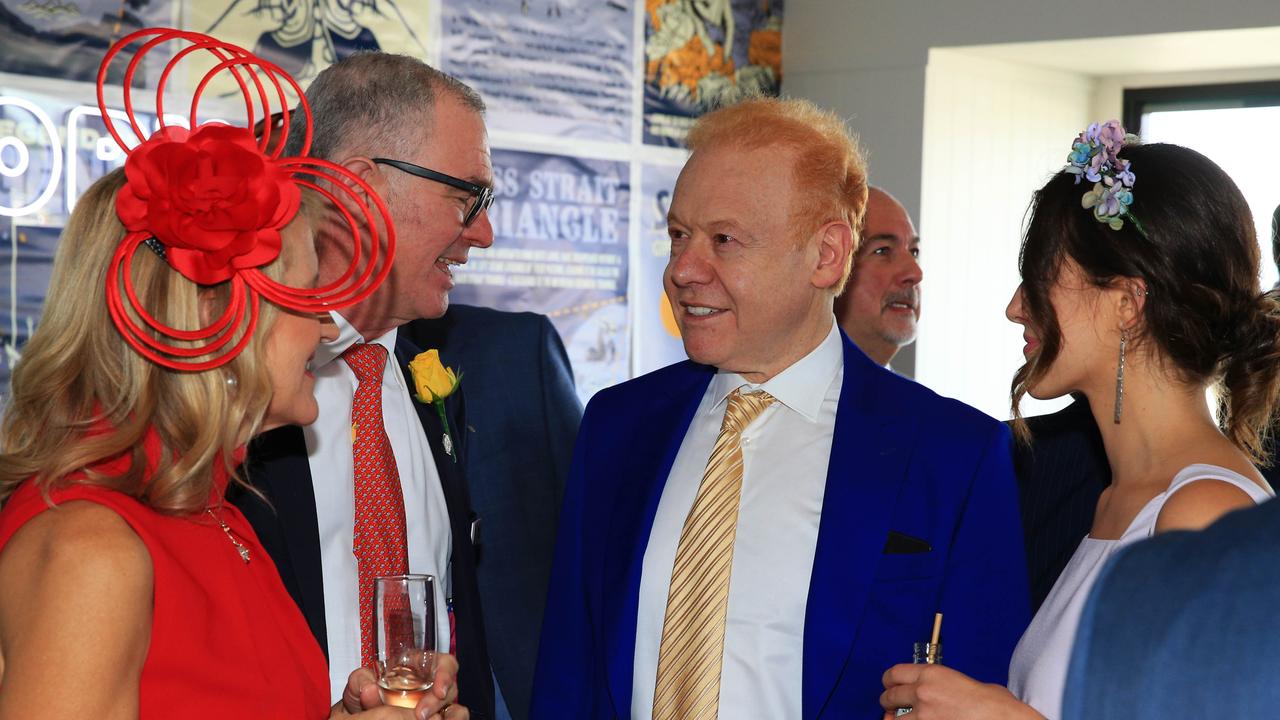 Visy chairman Anthony Pratt (centre) with Lion CEO Stuart Irvine in the Furphy marquee on Melbourne Cup day at Flemington Racecourse. Picture: Aaron Francis