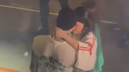 Kourtney Kardashian and Travis Barker share a prayer and kiss before his Blink 182 performance in Sydney. Picture: Supplied/Daniel Peters