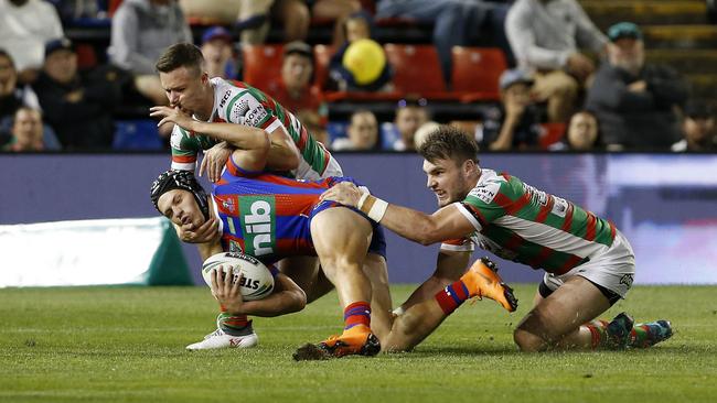 Kalyn Ponga is tackled during the Round 9 NRL match between the Newcastle Knights and the South Sydney Rabbitohs. (AAP Image/Darren Pateman)