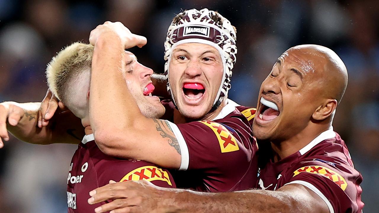 Cameron Munster, Kalyn Ponga and Felise Kaufusi celebrate Queensland’s Origin win. Picture: Mark Kolbe/Getty Images