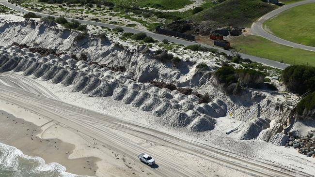 An aerial view of West Beach in 2015, near the Adelaide Shores Caravan Park, with dumped beach sand to replenish the eroded foreshore. Picture: Tait Schmaal.