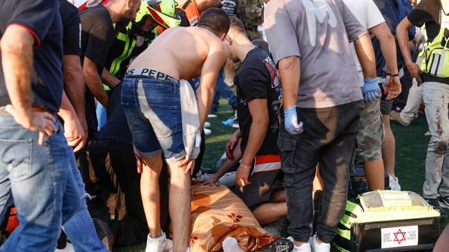 The wounded are treated after the strike. Picture: AFP