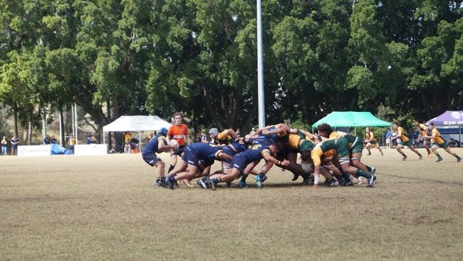 Bond University Scrum half Sam Dalton passing the ball out from the scrum.