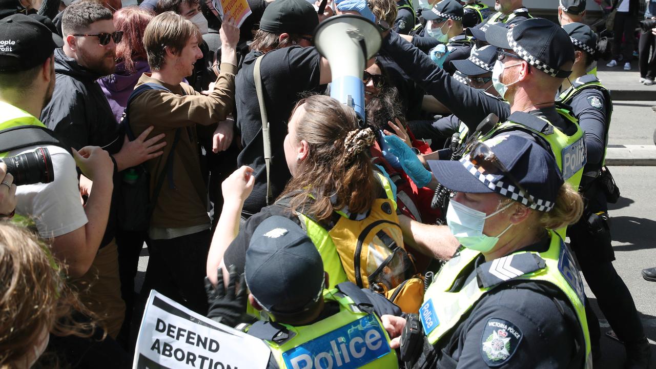 Police push back protesters. Picture: David Crosling