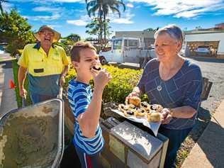 JOB DONE: Brickie Peter Moriz with his son Samuel and CWA president Irene Wells. Picture: TREVOR VEALE