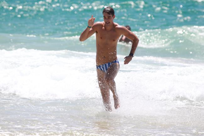 Josh Williams running out of the water during the Southport Sharks VFL preseason training camp at Tallebudgera Beach. Picture: Mike Batterham.