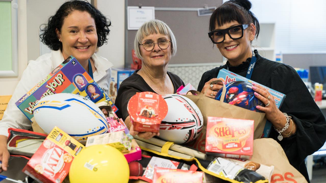 Lifeline admin officer Sandra Lee, volunteer Lesley Henry and Lifeline administrator Tracey Crighton pack together regular and Christmas hampers with toys brought in by an "anonymous" donor. December 18, 2024. Picture: Christine Schindler