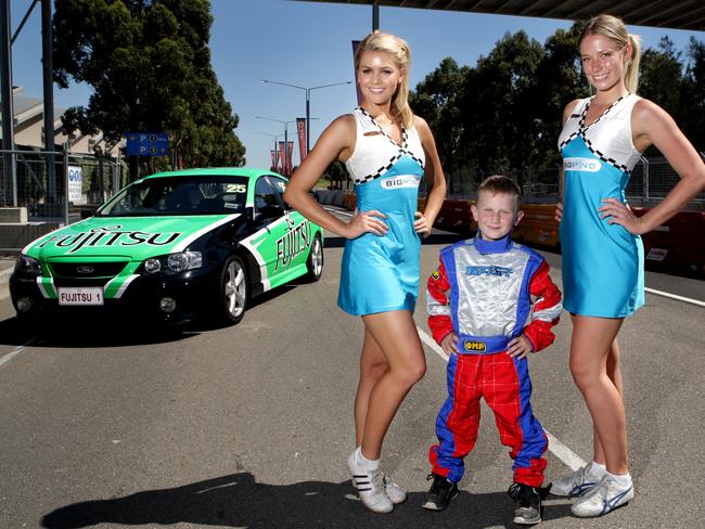 Grid girls Dani Byrnes (left) and Heidi Eichler on the Homebush V8 street circuit for the Sydney 500 in 2009.