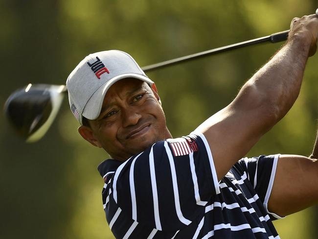 (FILES) In this file photo US golfer Tiger Woods plays a tee shot during his fourball match on the first day of the 42nd Ryder Cup at Le Golf National Course at Saint-Quentin-en-Yvelines, south-west of Paris on September 28, 2018. - Tiger Woods was hospitalized following a bad single-car accident in Los Angeles County on the morning of February 23, 2021, with officials requiring the jaws of life to free him from the vehicle. "On February 23, 2021, at approximately 7:12 am,  LASD responded to a single vehicle roll-over traffic collision on the border of Rolling Hills Estates and Rancho Palos Verdes," officials say. (Photo by Eric Feferberg / AFP)