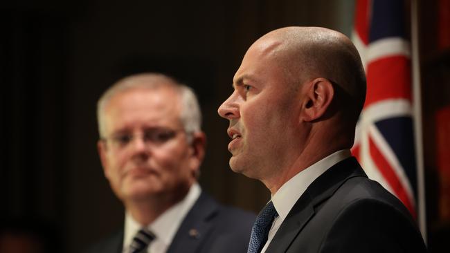 Scott Morrison watches on as Josh Frydenberg takes a question on the interest rate increases. Picture: Jason Edwards