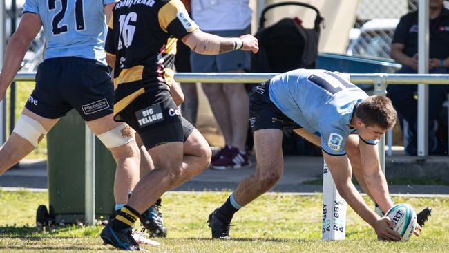 NSW player Archie Saunders scoring for the Waratahs last year.