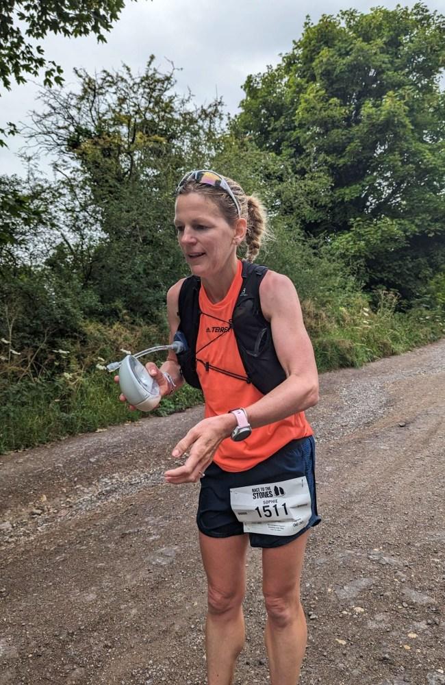 Sophie during the marathon with her breast pump. Picture: Caters News