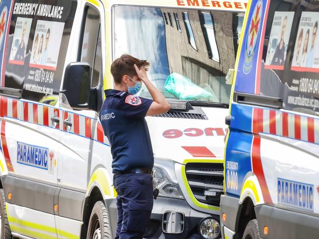 MELBOURNE, AUSTRALIA - NewsWire Photos 18 JANUARY 2022 : VictoriaÃs hospital system is under extreme pressure due to the covid-19 Omicron variant and a ÃCode brownÃ has been enforced.This will enable hospitals to cancel their staffs leave to ensure an adequate workforce is on hand. Ambulances parked at St VincentÃs Hospital. Picture : NCA NewsWire / Ian Currie