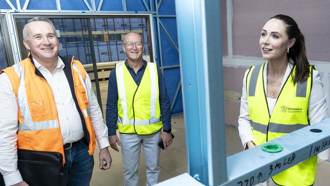 Housing Minister Meghan Scanlon with Adam Brockhurst from the Department of Housing and Rick Bell from VOLO at the Yatala factory.