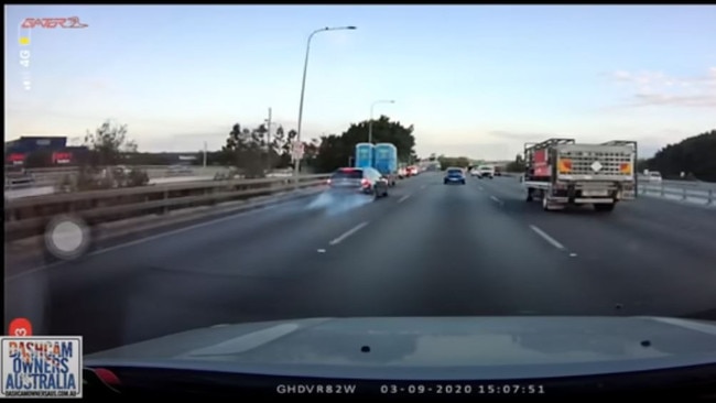 The car hits the brakes as traffic stops at the Oxenford exit.