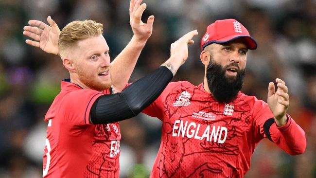 Ben Stokes celebrates with Moeen Ali. Photo by WILLIAM WEST / AFP