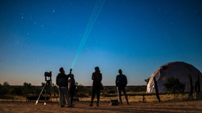 Brandishing a powerful laser, Tom begins by pointing out the Southern Cross and pointer stars. Picture: Matt Glastonbury (Tourism NT).