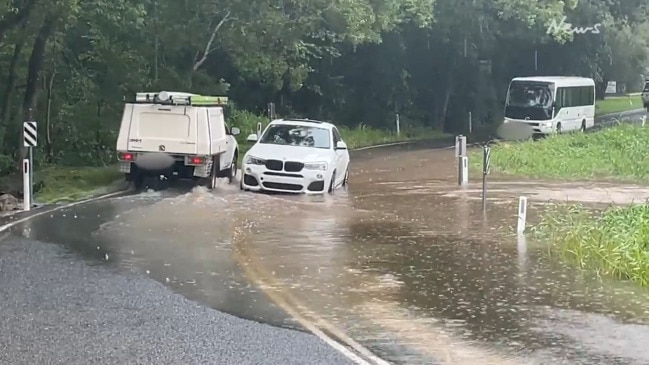 Vehicle stuck in floodwaters, Ninderry, Sunshine Coast