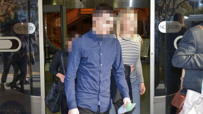 “The diarist”, centre, leaves court.