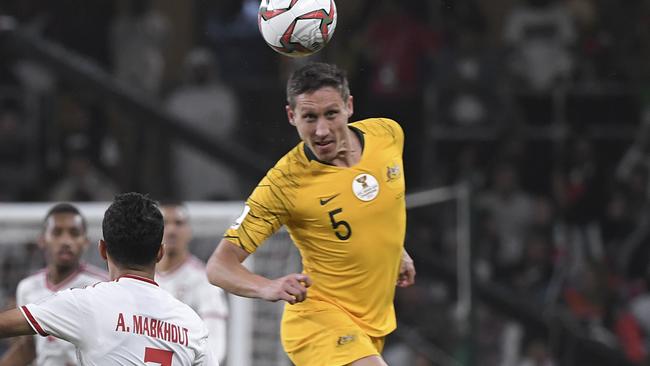 Australia's midfielder Mark Milligan vies for the ball with United Arab Emirates' forward Ali Mabkhout al Hajeri during the AFC Asian Cup quarterfinal soccer match between United Arab Emirates and Australia at Hazza Bin Zayed Stadium in Al Ain, United Arab Emirates, Friday, Jan. 25, 2019. (AP Photo/Hassan Ammar)