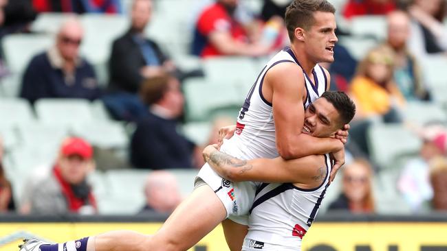 Harley Balic celebrates a goal with Michael Walters.