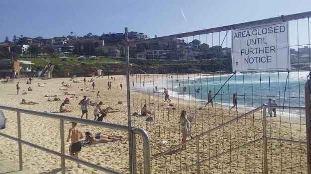 Beachgoers at Sydney's Bronte Beach, which is supposed to be closed.