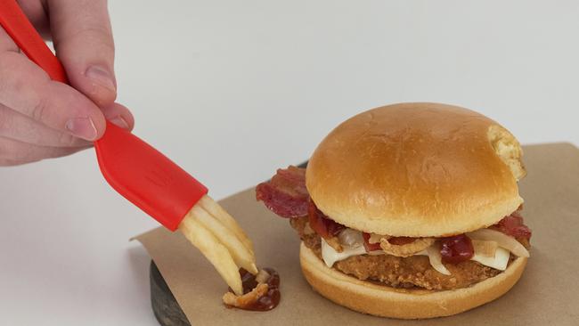 McDonald's shows a demonstration of the company's new French fry-centric utensil, the "frork". Picture: McDonald's via AP.