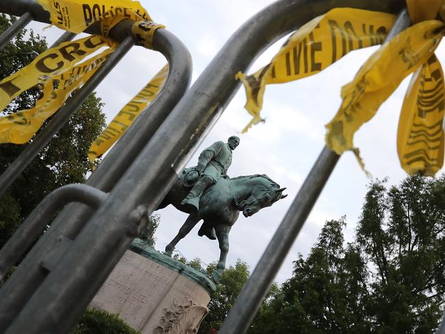 The statue of Confederat General Robert E. Lee stands in the centre of Emancipation Park the day after the Unite the Right rally devolved into violence. Picture: Chip Somodevilla/Getty Images/AFP