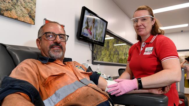 DONATING: Derek Vanderkoogh gives blood at Nambour with the help of Karlene LeCouteur Photo: Warren Lynam