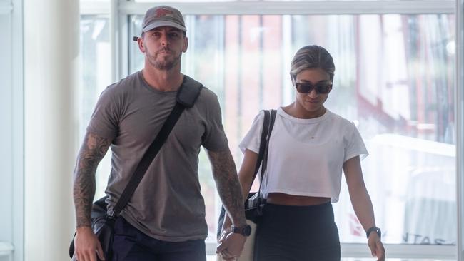 Zachary Rolfe and his girlfriend arrive in Alice Springs on Sunday evening ahead of giving evidence at the inquest into the death of Kumanjayi Walker. Picture: Liam Mendes