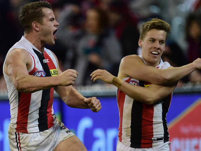 Maverick Weller and Jack Lonie celebrate a final-term goal. AAP Image/Julian Smith.