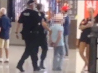 Police take the teen accused of the stabbing into custody. Picture: Supplied