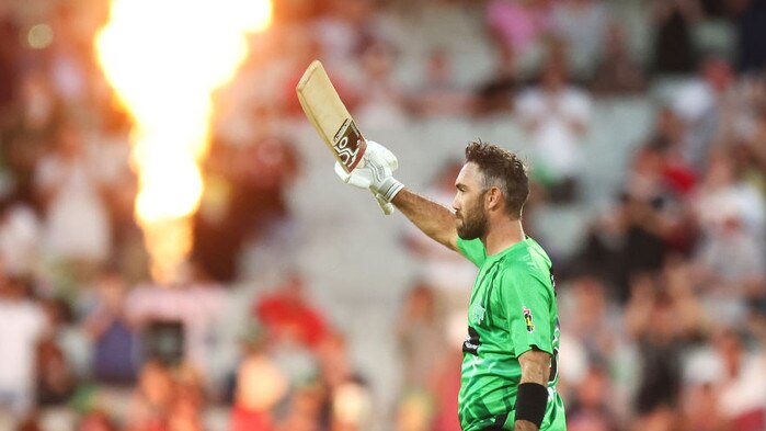 MELBOURNE, AUSTRALIA - JANUARY 19: Glenn Maxwell of the Stars raises his bat after scoring a century during the Men's Big Bash League match between the Melbourne Stars and the Hobart Hurricanes at Melbourne Cricket Ground, on January 19, 2022, in Melbourne, Australia. (Photo by Mike Owen/Getty Images)