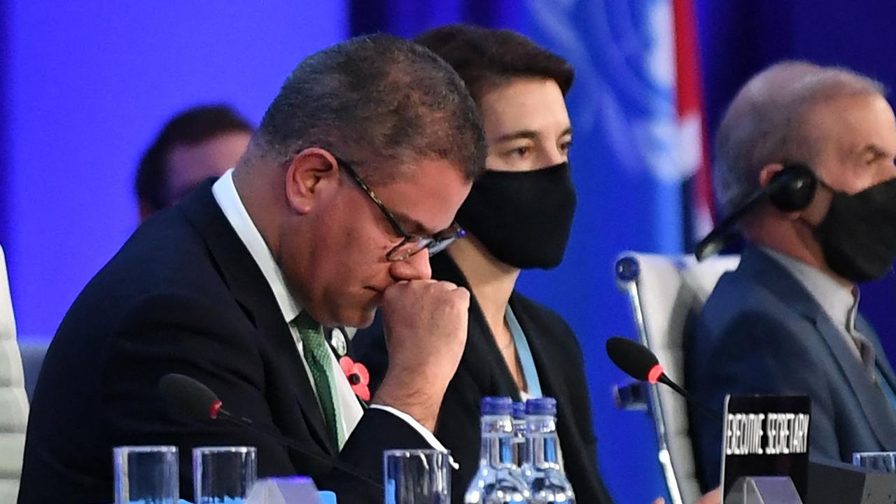 Britain's President for COP26 Alok Sharma (L) reacts as he makes his concluding remarks during the COP26 UN Climate Change Conference in Glasgow. Picture: Paul Ellis / AFP