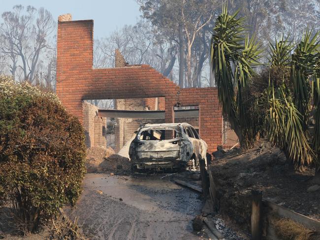 Properties still smoulder after the devastating blaze. Pictures: Ray Strange