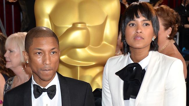 Pharrell Williams (L) and wife Helen Lasichanh attend the Oscars in 2014.  Picture:  Getty