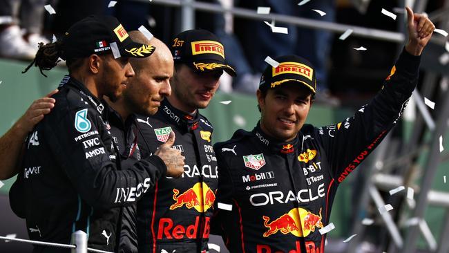 Race winner Max Verstappen (third left), Lewis Hamilton (left), Sergio Perez (right) and Red Bull Racing race engineer Gianpiero Lambiase on the podium after the Mexico Grand Prix.