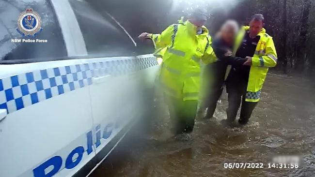 Police assisted the woman out of her vehicle and back to safety.