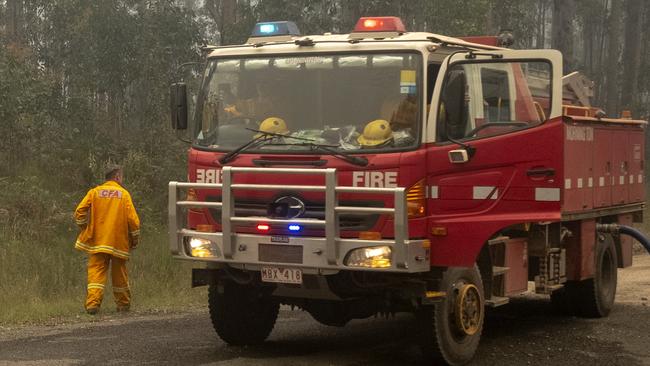 A fire truck refills along the Princes Highway near Mallacoota on January 1. Picture: Luis Ascui/Getty Images