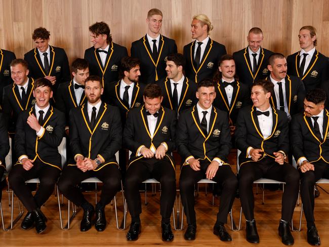 MELBOURNE, AUSTRALIA - AUGUST 30: The 2023 All-Australian team Back Row (L-R) Jordan Dawson of the Crows, Charlie Curnow of the Blues, Nick Larkey of the Kangaroos, Tim English of the Bulldogs, Darcy Moore of the Magpies, Callum Wilkie of the Saints, Tom Stewart of the Cats - Middle Row (L-R) Errol Gulden of the Swans, Dan Houston of the Power, Zach Merrett of the Bombers, Josh Daicos of the Magpies, Christian Petracca of the Demons, Jack Sinclair of the Saints, Taylor Walker of the Crows, James Sicily of the Hawks - Front Row (L-R) Caleb Serong of the Dockers, Zak Butters of the Power, Marcus Bontempelli of the Bulldogs, Toby Greene of the Giants, Nick Daicos of the Magpies, Connor Rozee of the Power and Charlie Cameron of the Lions chat after the official team photo during the 2023 AFL Awards at Centrepiece on August 30, 2023 in Melbourne, Australia. (Photo by Dylan Burns/AFL Photos via Getty Images)