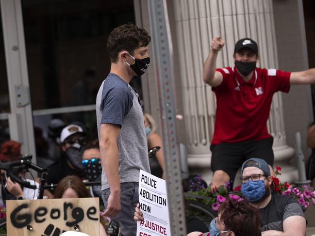 Minneapolis Mayor Jacob Frey leaves a demonstration calling for the Minneapolis Police Department to be de-funded.