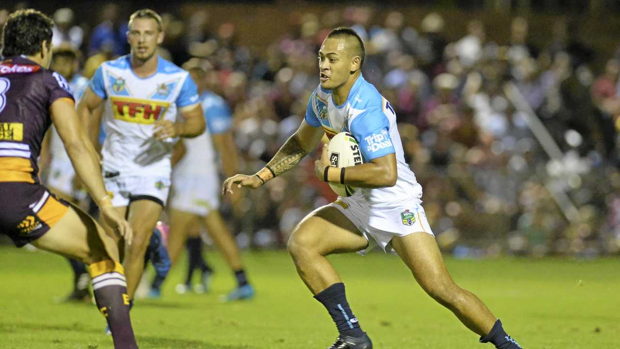 IN ACTION: Gold Coast Titans player Philip Sami runs at the Brisbane Broncos defence during their recent trial game in Toowoomba. Sami has been named in the Titans sides for this weekend's NRL match at Clive Berghofer Stadium. Picture: Kevin Farmer