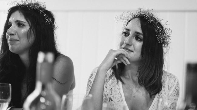 Bridesmaids Selen Sen and Rebecca Sheppard react to an emotional speech. Picture: Perspectives Photography