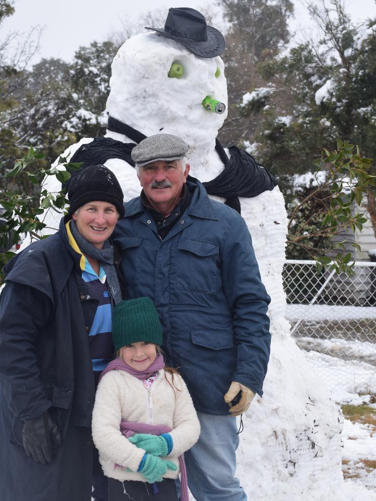 Janine and Steve Siebenhausen with granddaughter Holly Hogan enjoying the snow at Wallangarra. Photo: Alex Nolan / Stanthorpe Border Post