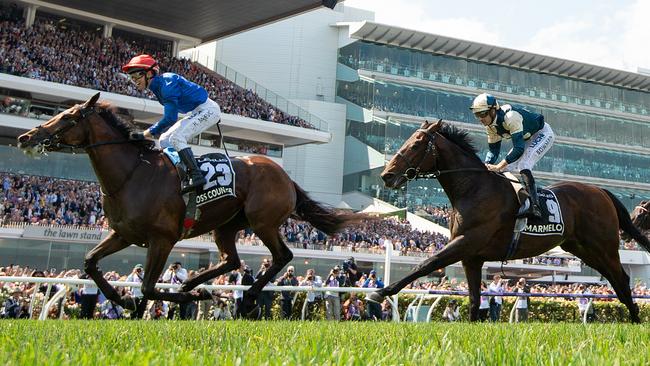 Kerrin McEvoy salutes the crowd after riding Cross Counter to victory in the Melbourne Cup. Picture: AAP