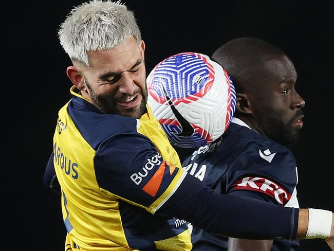 GOSFORD, AUSTRALIA - MAY 25: Christian Theoharous of the Central Coast Mariners and Jason Geria of the Victory compete for the ball during the A-League Men Grand Final match between Central Coast Mariners and Melbourne Victory at Industree Group Stadium, on May 25, 2024, in Gosford, Australia. (Photo by Mark Metcalfe/Getty Images)