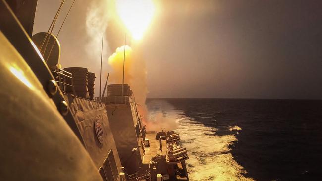 The Arleigh Burke-class guided-missile destroyer USS Carney repels a combination of Houthi missiles and unmanned aerial vehicles in the Red Sea soon after the Israel-Hamas war began. Picture: Aaron Lau / US Navy / AFP