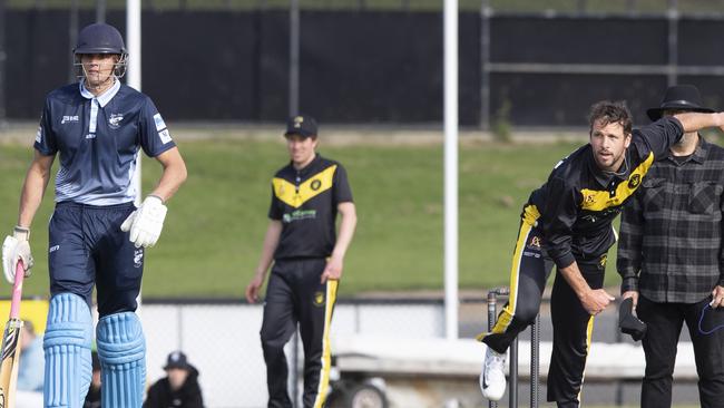 Travis Boak bowling for Torquay, while Charlie Curnow is batting for Jan Juc. Picture: Alan Barber