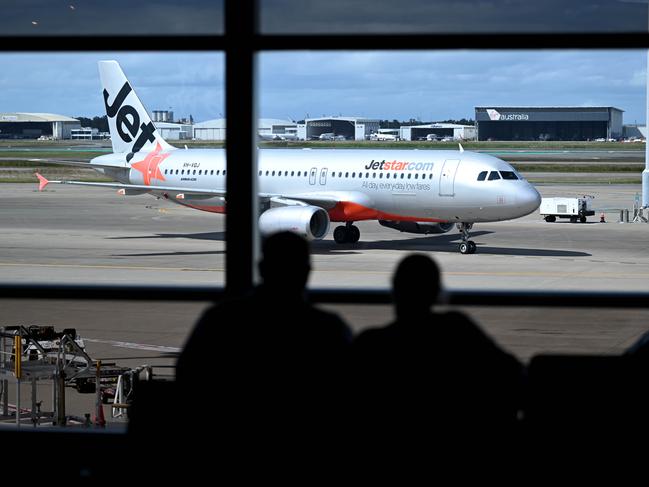 BRISBANE, AUSTRALIA - NewsWire Photos - AUGUST 11, 2022. A Jetstar plane arrives at Brisbane airport. Industrial action will start at Qantas and budget offshoot Jetstar by the end of August amid an escalating fight over pay with its licensed engineers.Picture: NCA NewsWire / Dan Peled