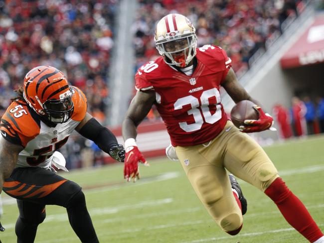 Kendll Gaskins carries the ball against the Bengals last season.